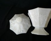 A footed, octagon shaped dish of opalescent white milk glass with lid