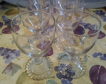 Set of 8-8 fluid ounce water or wine glasses on a bubble pedestal by Anchor Hocking. Glass 105