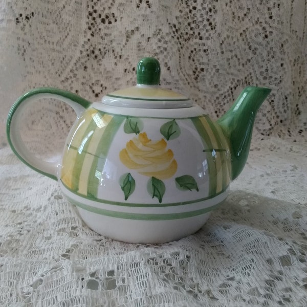 Tea for one!  A white Royal Norfolk 13 oz teapot with a green and yellow design with a yellow rose.  CS 224