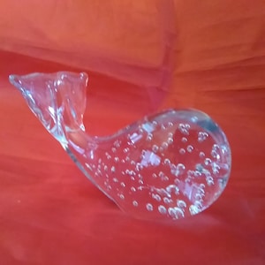 A clear crystal paperweight whale figurine with floating bubbles.  Misc 112