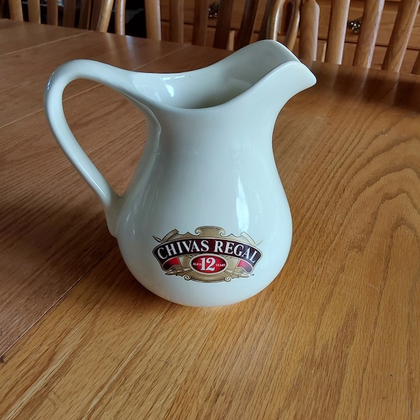 An ivory Chivas Regal Scotch Whiskey 32 oz ceramic pitcher with their logo from 12 years ago. Not for microwave use.  Bar 1147