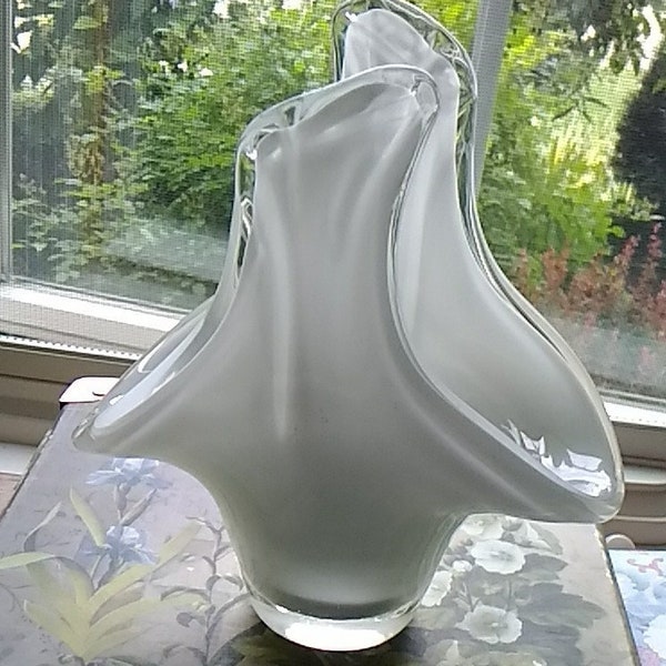 A beautiful art glass white and clear hand blown piece in the shape of an open handled basket that could be used as a vase.  Vase 304