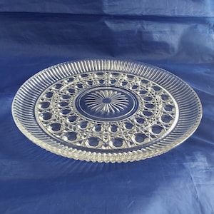A 11" Windsor Cane and Button clear round Federal Glass serving platter with a ring formed 2" from the edge around the center.  Plate 826