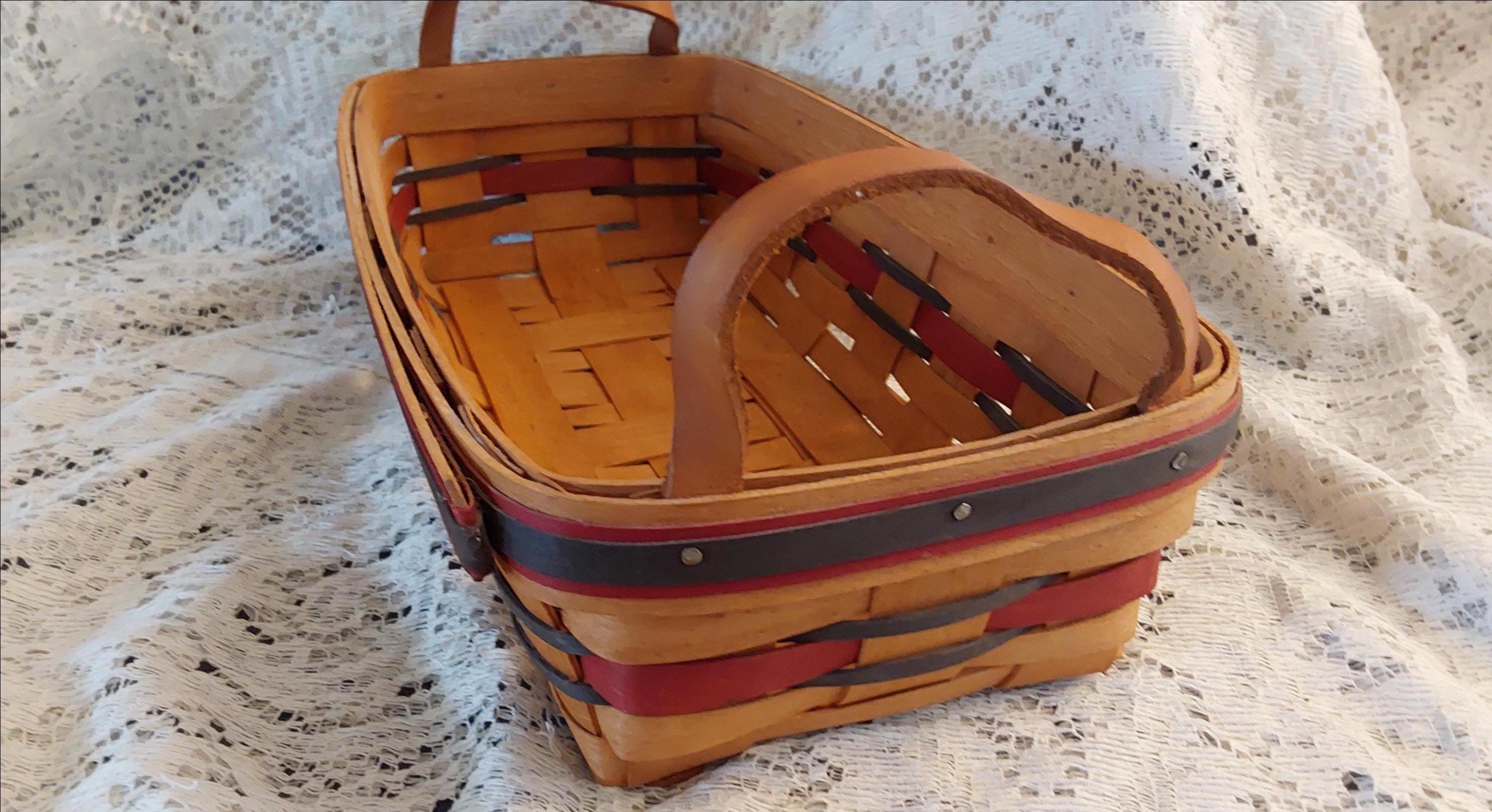 A Longaberger Woven Basket, Stamped on the Bottom, Along With the