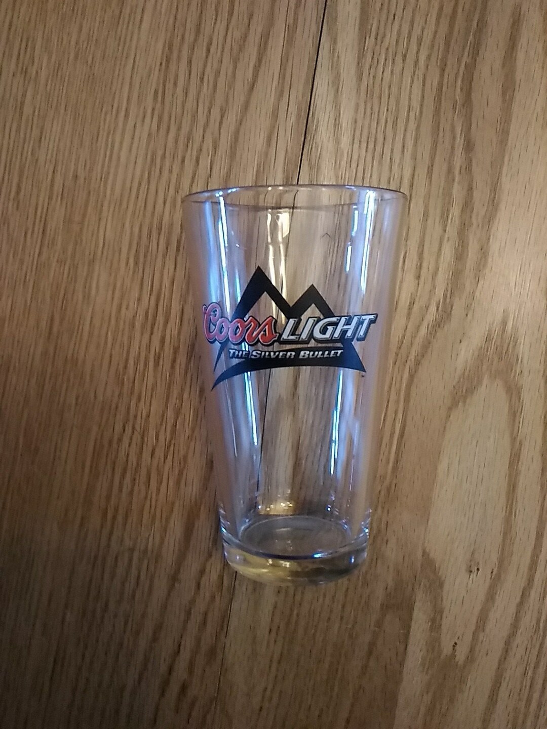 A Coors Light the Silver Bullet Logo on a Pint Clear Glass Flat