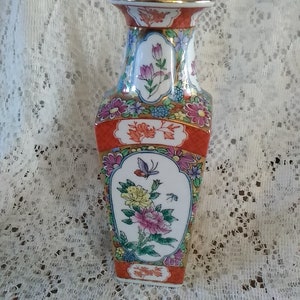 A 8&quot; tall white ceramic chinouserie Chinese decorative square porcelain vase with a variety of floral pics in an array of colors.  Vase 352