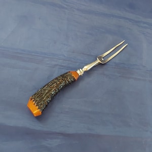 Vintage meat fork with knife stand that has a bakelite fax antler horn 4.5&quot; handle and 6&quot; stainless steel tines. Dish 1617