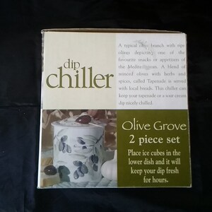In original its carton, is Gourmet Village 2 piece ceramic dip chiller with an olive design with a larger bowl.  Dish 1351