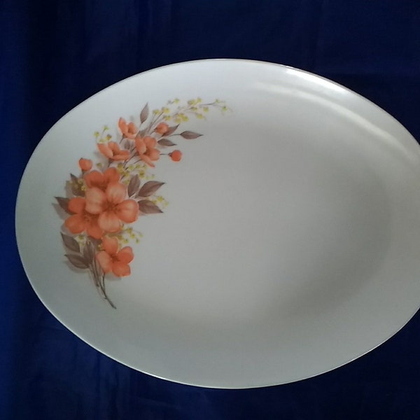 A Mar-crest melmac white oval platter Golden Dawn pattern or orange flowers with yellow floral accents.  Plate 460