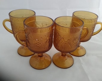 Set of 4-8 oz amber stemmed Tiara Glass or Sandwich Glass mugs with handles and multiple sets available.  Tiara  3