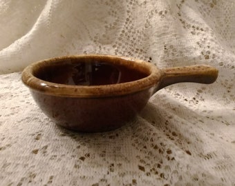 A marked Hull Pottery drip glaze bowl for soups or chilis with a handle. SW 227