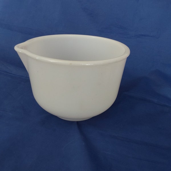 Sunbeam white milk glass mixing bowl from 1950s by Glasbake with a pouring spout. It is the smaller of the two that was offered. MG 369