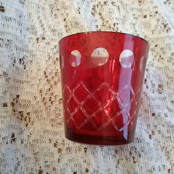 A brilliant red 6 oz ocks glass with an etched geometric design of circles and stacked diamonds that could also a candle holder.  Misc 1269