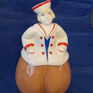 A large 1940s cookie jar of a yellow haired Sailor or Dutch Boy that is 13&quot; tall, made by Pottery Guild of America.  Misc 1392