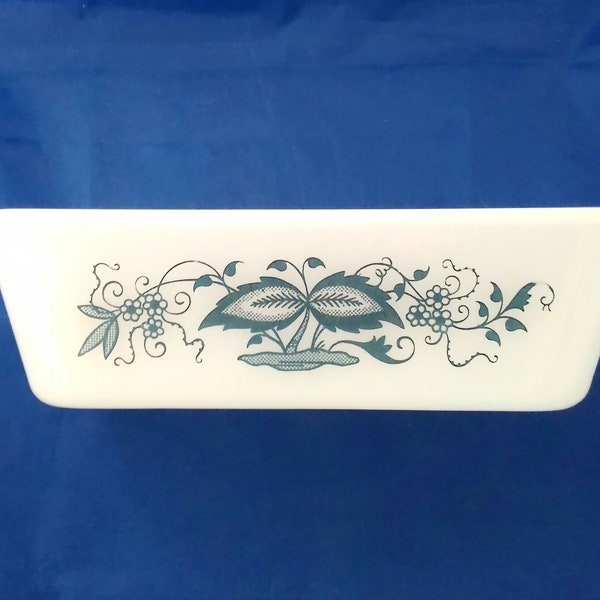 A white milk glass Glasbake loaf pan with navy blue "Blue Onion" graphics.  Dish 975