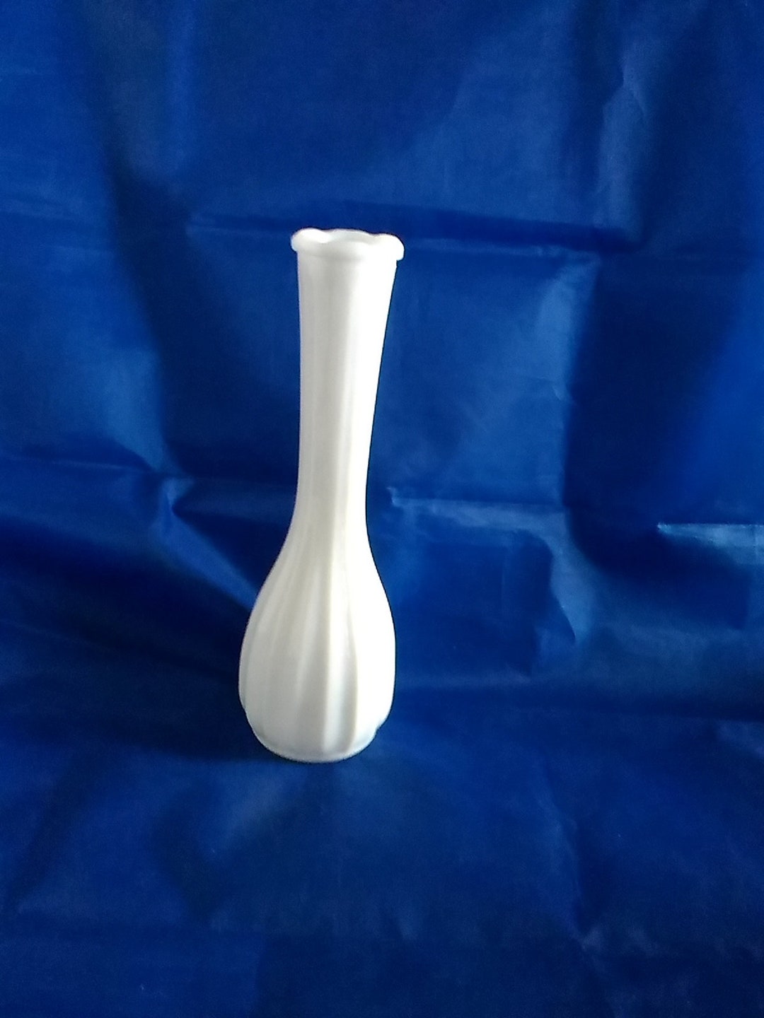 An 8.5 Inch Tall White Milk Glass Ribbed Bud Vases Embossed CLG on the