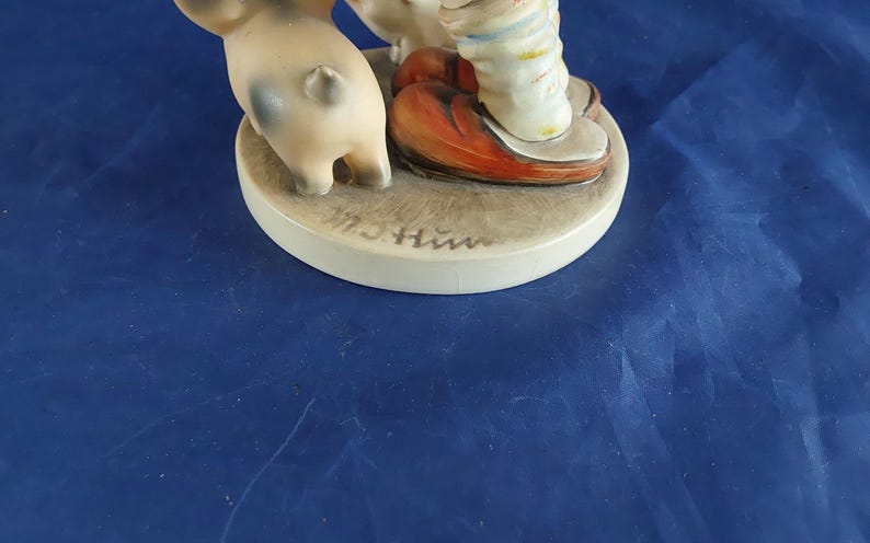 A vintage Farm Boy with Piglets-number 66, marked M J Hum on the top and "V" with a bee-W Germany blue backstamp 1960s. Misc 2051 image 5