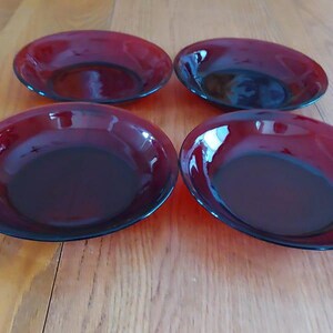 Selling as a set as 4 transparent Ruby Red glass Arcoroc Glass soup or salad bowls.  The bowls measures 8.5 " across the flat rim.  DWS 825