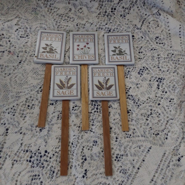 Five ceramic herb garden markers-2 sage, 2 basil, 1 chives.  The ceramic piece is 3.25" by 2.5" on stick that makes them 9" long.  Misc 1377