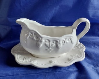 A white ceramic, marked Bico China, gravy or sauce boat with matching oval underplate.  Dish 1737