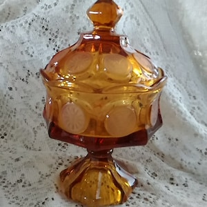 A Fostoria Glass amber gold pedestal "Coin" designed 8.5" stemmed compote with matching lid.  Bowl 1142
