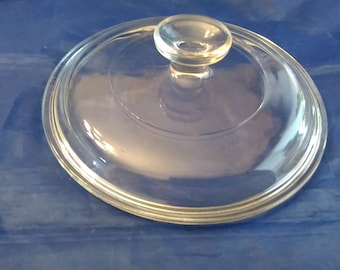 A clear glass Pyrex round replacement lid that is marked G-5-C is 7.75" across for 1.5 liter for a 7.25" Pyrex or Corningware dish.  CD 106