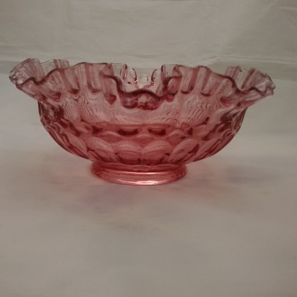 A Fenton pink raspberry colored thumbprint bowl with a double ruffle.  Bowl 549