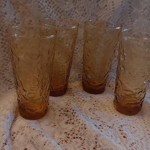 A set of 4 Anchor Hocking amber gold 8 fluid ounce water glasses in the Lido Milano crinkle pattern, 2 sets available. Glass 821