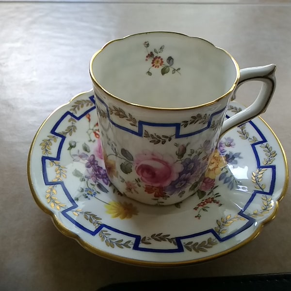 A Royal Crown Derby demitasse floral cup and saucer.  Misc 316