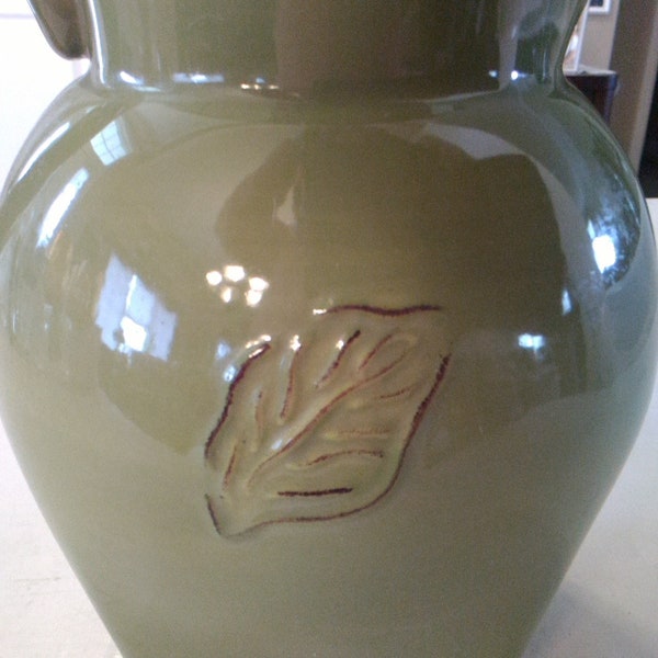 A 2 quart Tastefully Simple green leaf motif design ceramic pitcher. Pitcher 45
