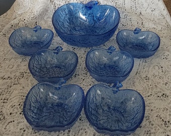 Blue glass textured apple shaped bowl set of 7.  There are 6 individual bowls and a master serving bowl, attributed to Italy.  Bowl 1216