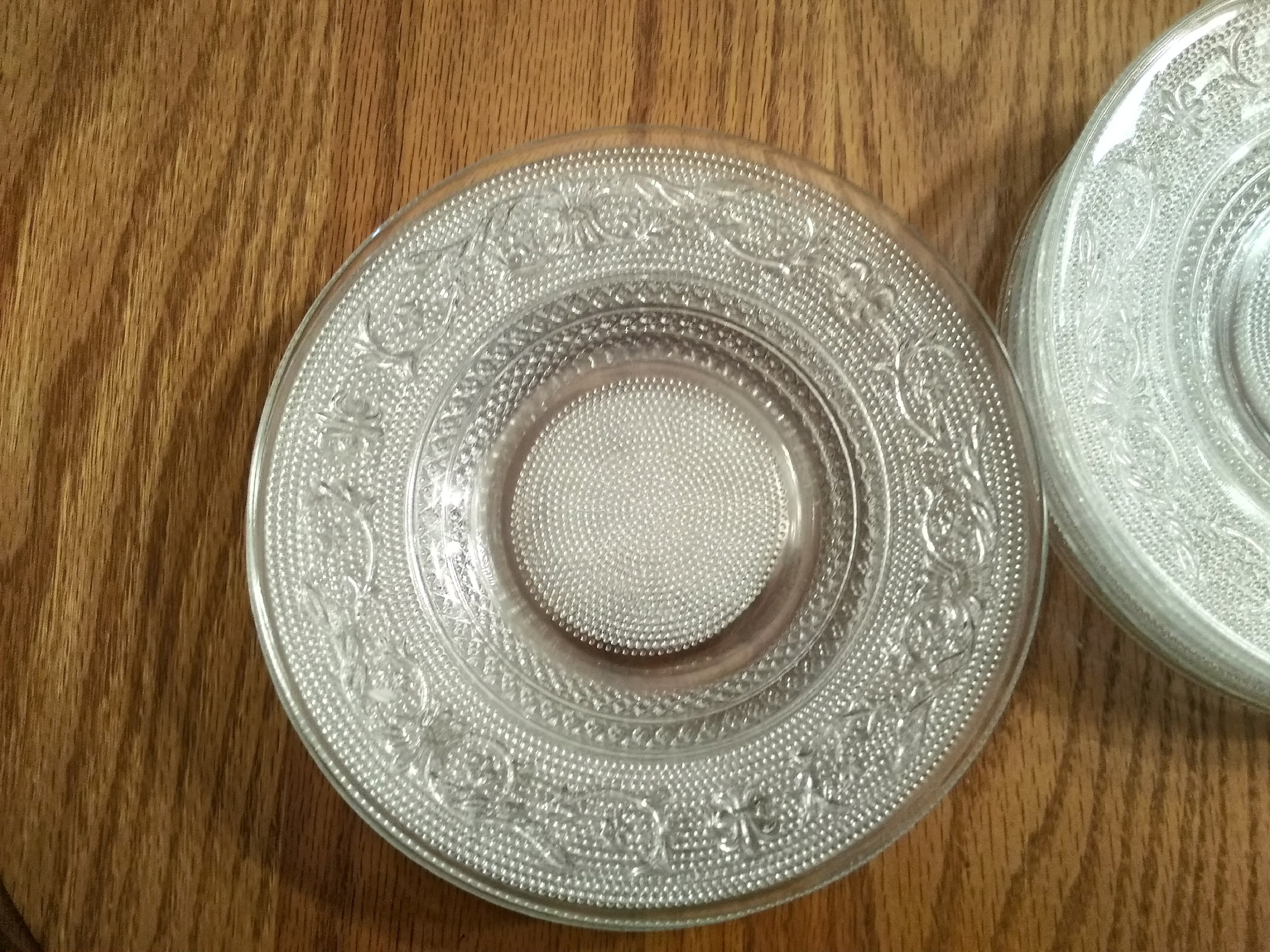 Set of 97 matching glass dessert plates in a fleur de Etsy