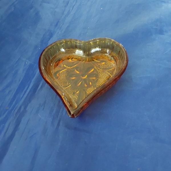 An amber gold Tiara or Sandwich glass heart shaped nut dishes by Indiana Glass, for your next card game.  Check my site for more.  Tiara 170