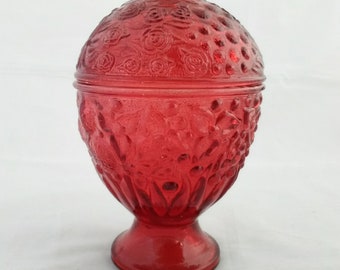 An Avon red glass pedestal compote with matching lid.  Bowl 482