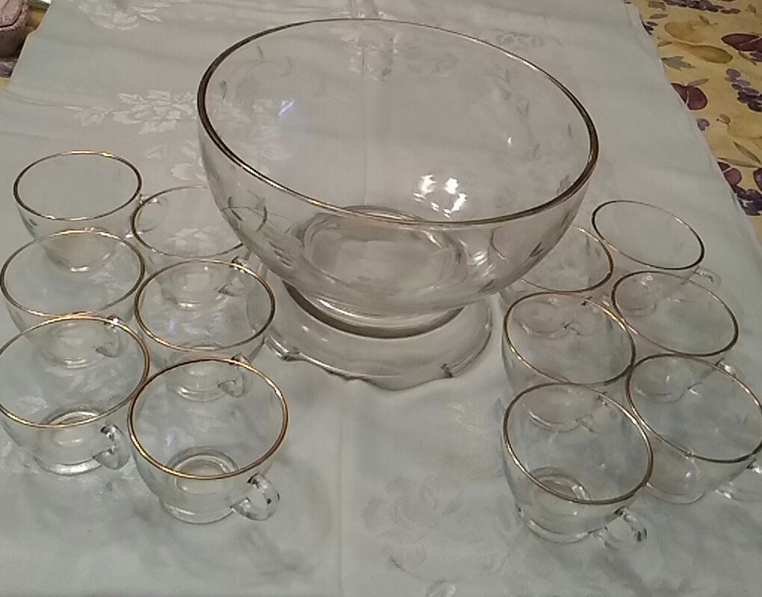 A 14 Piece Punch Bowl Set With a Grape Etched Design on Matching Glass