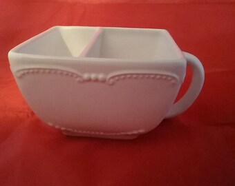 A large soup and crackers, veggies and dip, or chips and dip bowl by Avon divided ceramic square mug with an embossed design.  Avon C 68