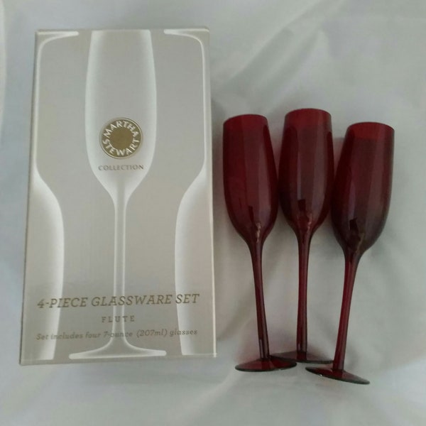 By Martha Stewart, a set of 3-7 fluid ounce red stemmed flutes in their original box.  Bar 789