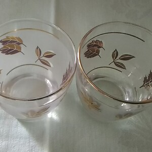 Set of 2 matching Libbey Glass low ball frosted tumblers with gold leaf design. Glass 476