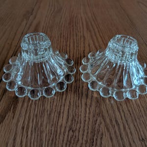 Set of 2 matching clear glass boopie bubble taper candle holders by Anchor Hocking, with multiple sets available.  Candle 133