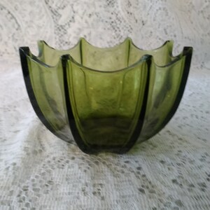 By Indiana Glass, it is an avocado colored umbrella bowl.  Bowl 1004