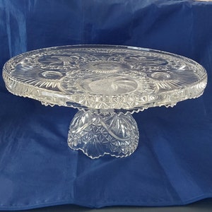 A 12" wide Hofbauer Byrdes crystal pedestal 5.25" tall cake stand ftom West Germany, that can be invert for relish tray and dip.  Byrdes 31