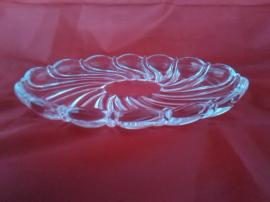 A Mikasa crystal oval dish in the their popular swirl pattern. Etsy