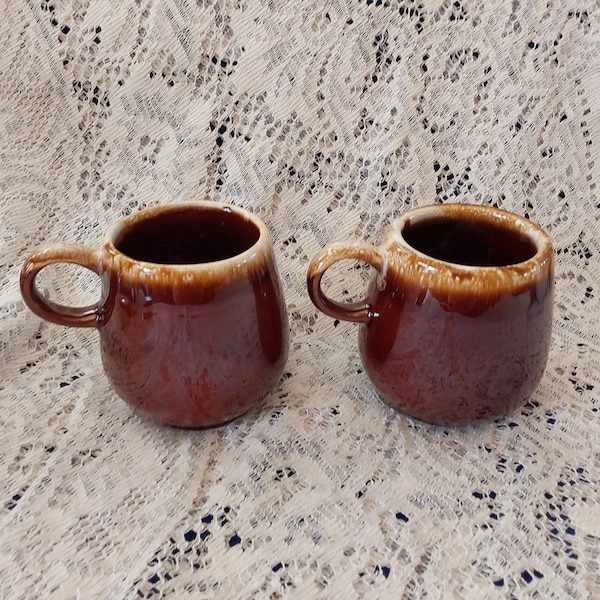 A matching set of 2 marked McCoy Pottery 7025 brown drip glazed 12 oz coffee mugs with handles. Multiple sets available. SW 298