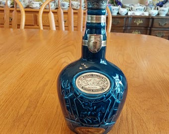 Empty Chivas Brothers cobalt blue ceramic decanter by Spode Pottery, with original labels intact and a knight, horse, armor scene.  Bar 1244