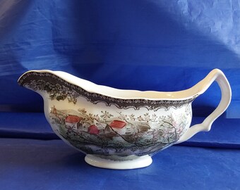 An original Friendly Village gravy boat entitled "Apple Orchard", with the 1940's brown backstamp.  They were made in England.  FV 79
