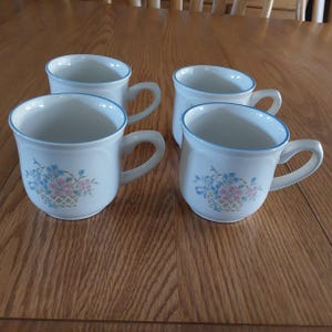 A Matching Set of 4 Johann Haviland 12 Oz Cream Colored Ceramic