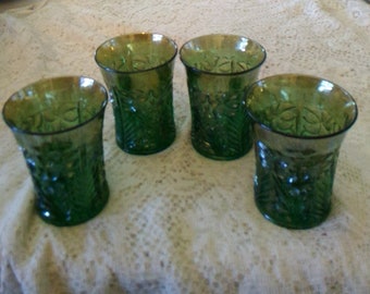 By Imperial, circa 1910, is a green carnival glass Tiger Lily patterned 4 flat bottomed tumblers.  Glass 532