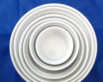 Selling as a set of 6 nested white ribbed round dishes/bowls for mixing prep or serving.  Bowls 1207