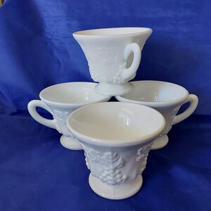 A matching set of 4 Indiana Glass pedestal punch cups in the Colony Harvest pattern of grape clusters.  Each holds 6 fluid ounces.  MG 357