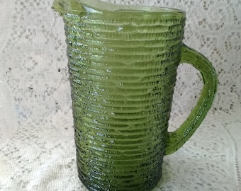 Soreno avocado green glass small 26 fluid ounce juice pitcher by Anchor Hocking from the 70s.  Pitcher 61